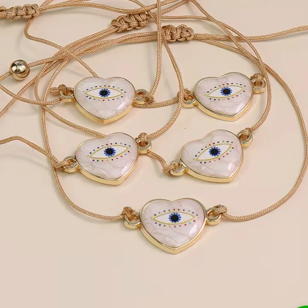 Gold and Pearlized Heart Evil Eye Adjustable Rope Bracelet - Picture 2 of 3